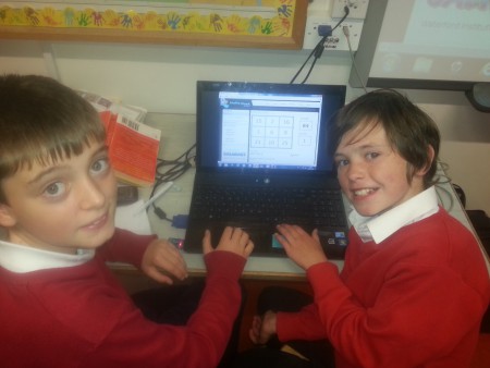 Maths Week activities, Tim and Jamie working together on a Target Board.